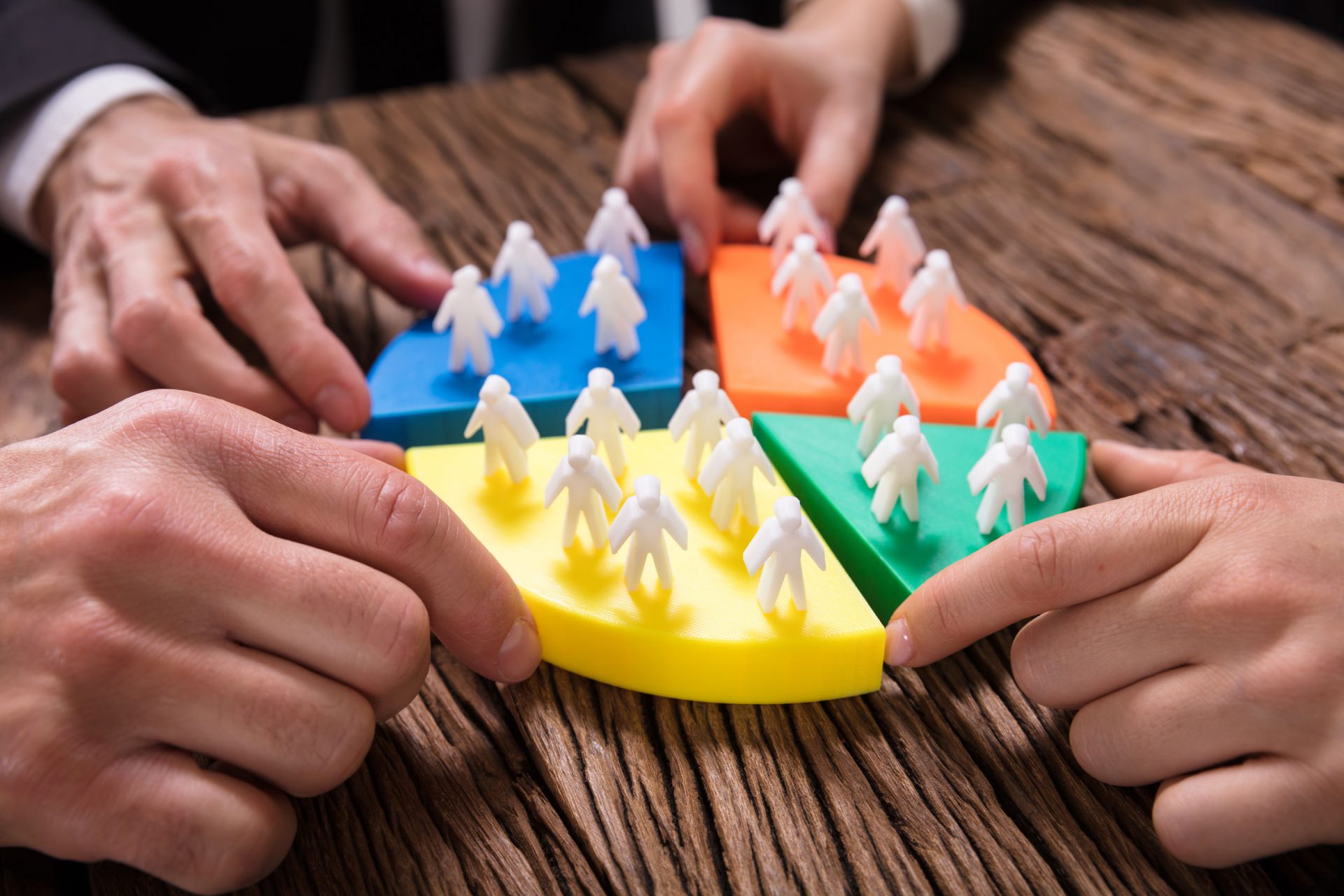 Businesspeople Connecting Pieces Of Pie Chart With Human Figures